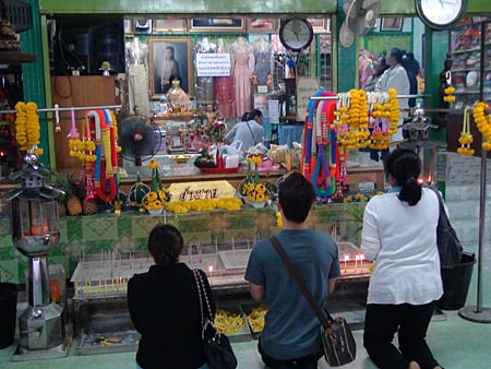 Worshippers in front of Mae Nak 